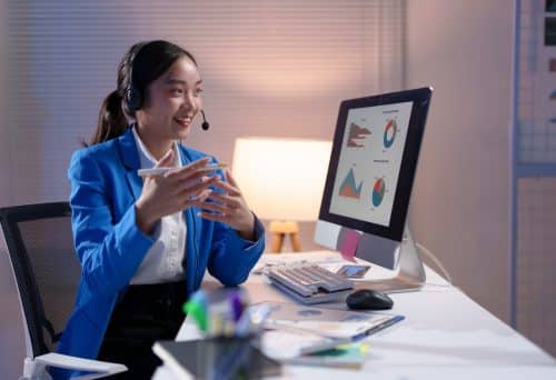 Young-professional-woman-wearing-a-headset-engagi-2025-02-20-03-10-57-utc