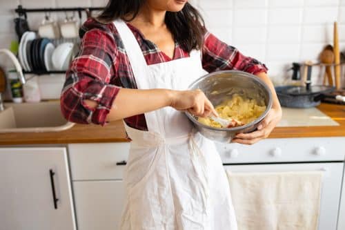 Woman-making-apple-pie-in-the-kitchen-close-up-of-2025-03-13-01-05-52-utc