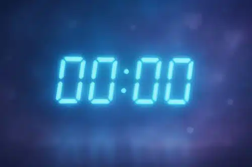 Horloge numérique affichant 00h00 avec une lueur douce et éthérée